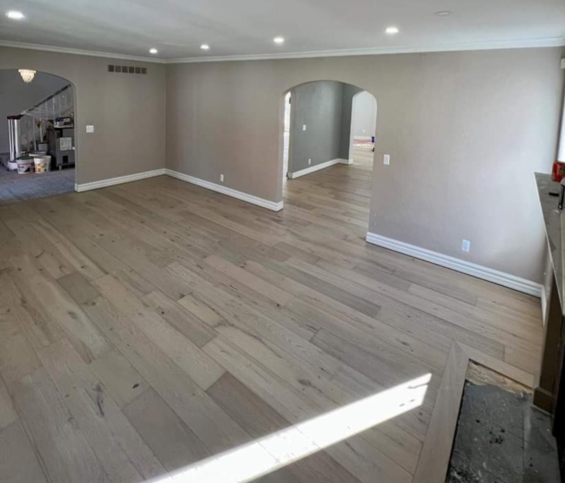 A completed hardwood floor project in an empty home.